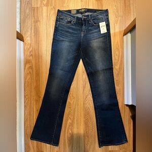 Dark wash boot cut low rise jeans